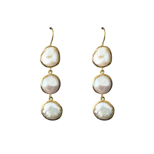 Pair of gold-framed pearl earrings on a white background